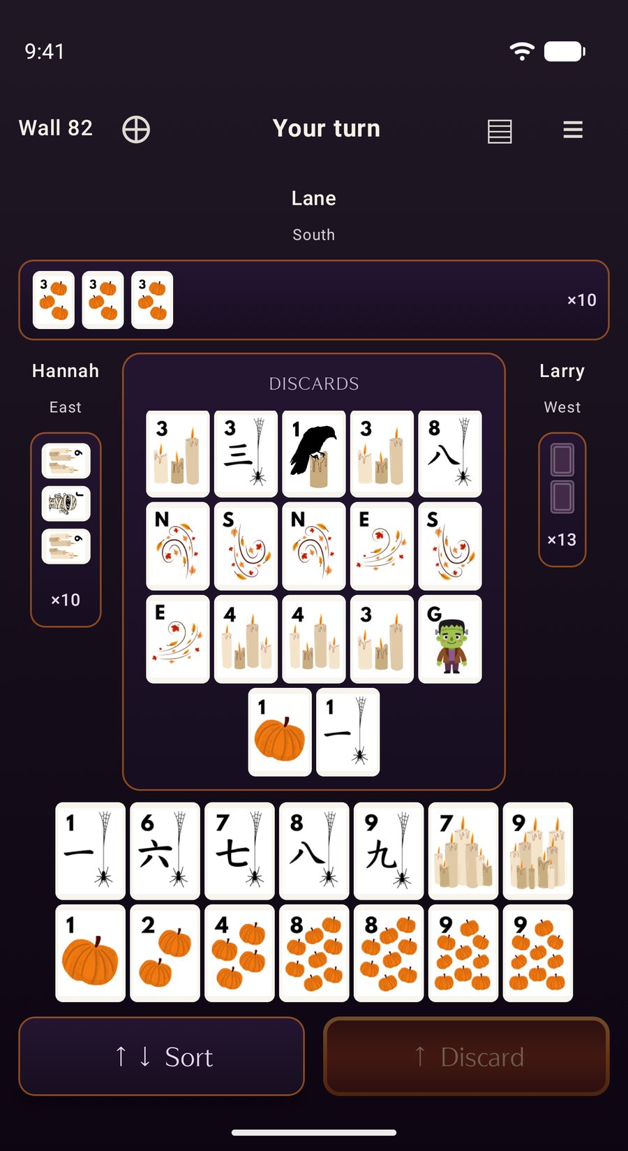 A mid-hand table on Android with the Harvest tile set on midnight purple. It is your turn: two opponents have exposed tiles, the discard floor is filling with candles, spiders, winds and a pumpkin, and your hand of pumpkins, candles and spider craks is racked below